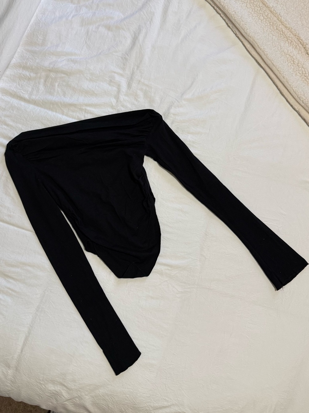 Asymmetrical Neckline Long Sleeve Top, that comes to a point.